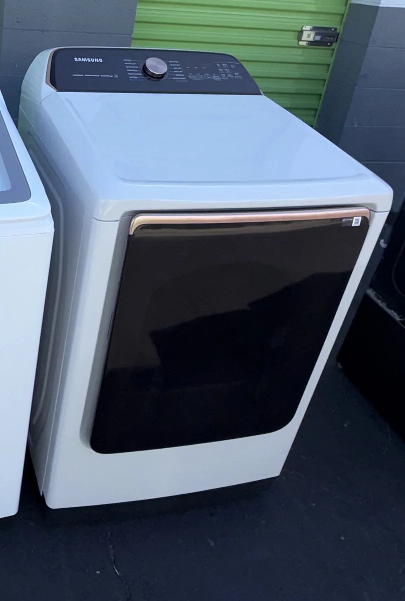 White Samsung steam dryer with rose-gold accent